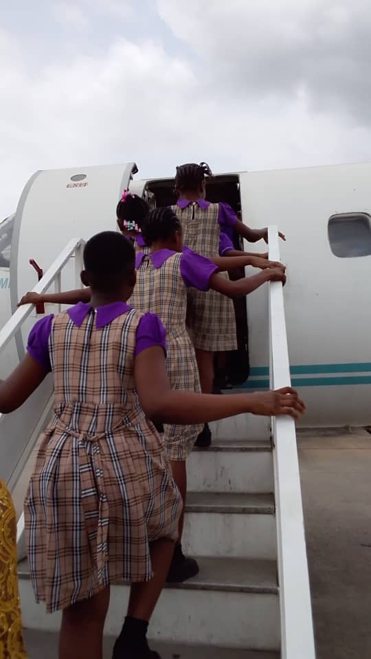Mercy Academy pupils boarding an aircraft for a school outing