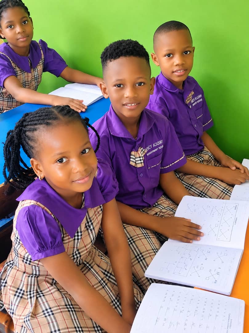 Pupils working together around a classroom table