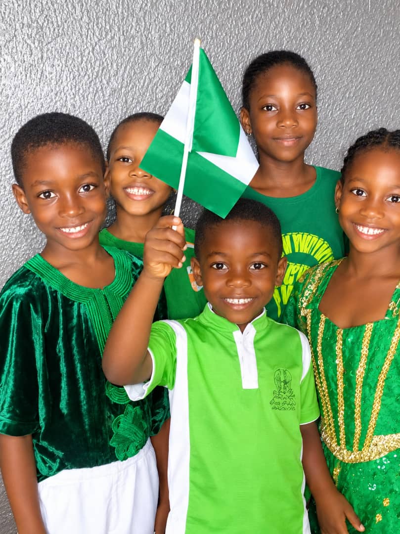 Pupils celebrating together with the Nigerian flag